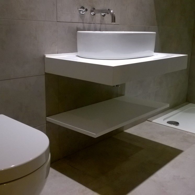 Large tiles in small bathroom with down lighting